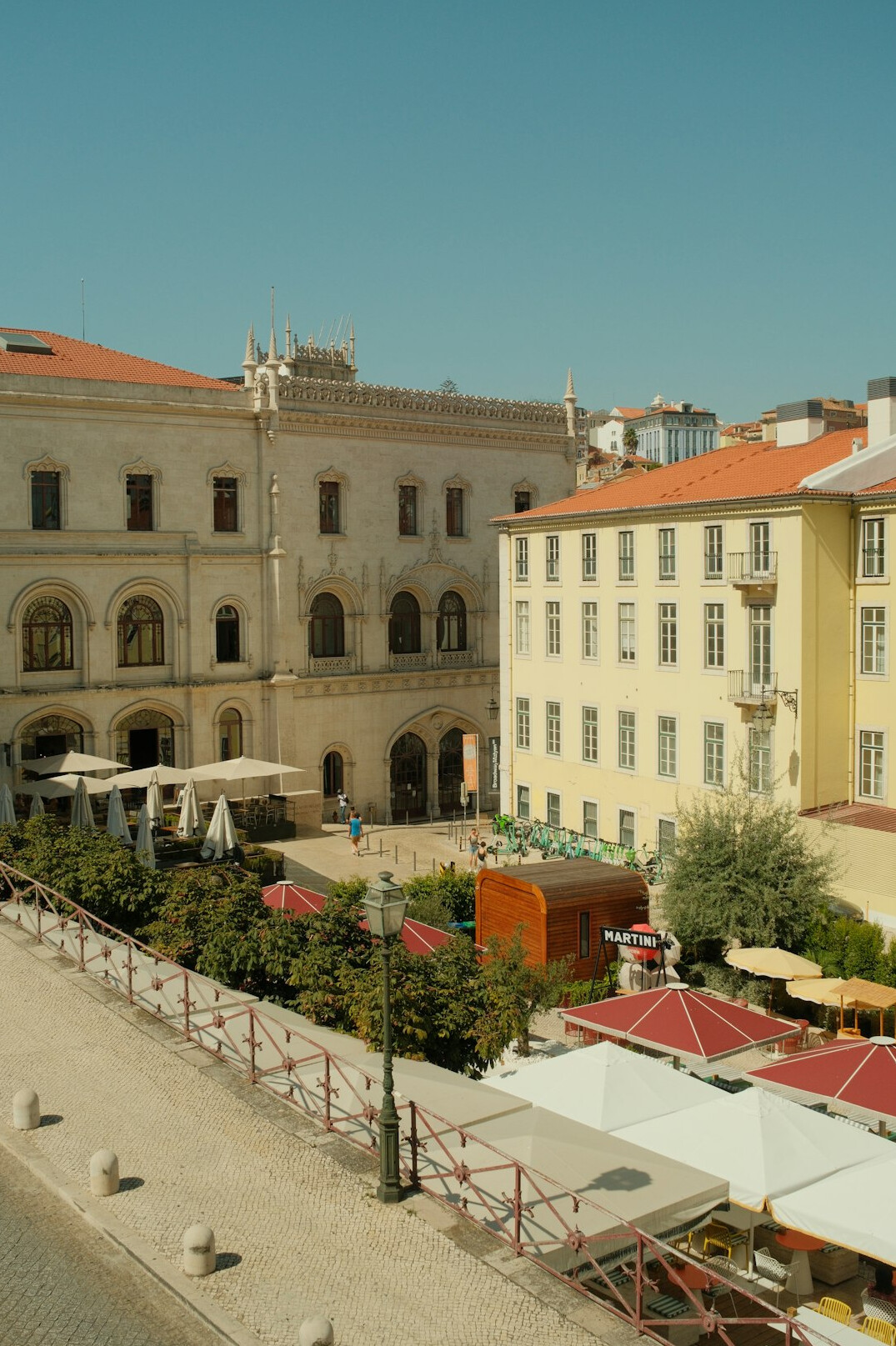 Lisbon historic square with government buildings and arches