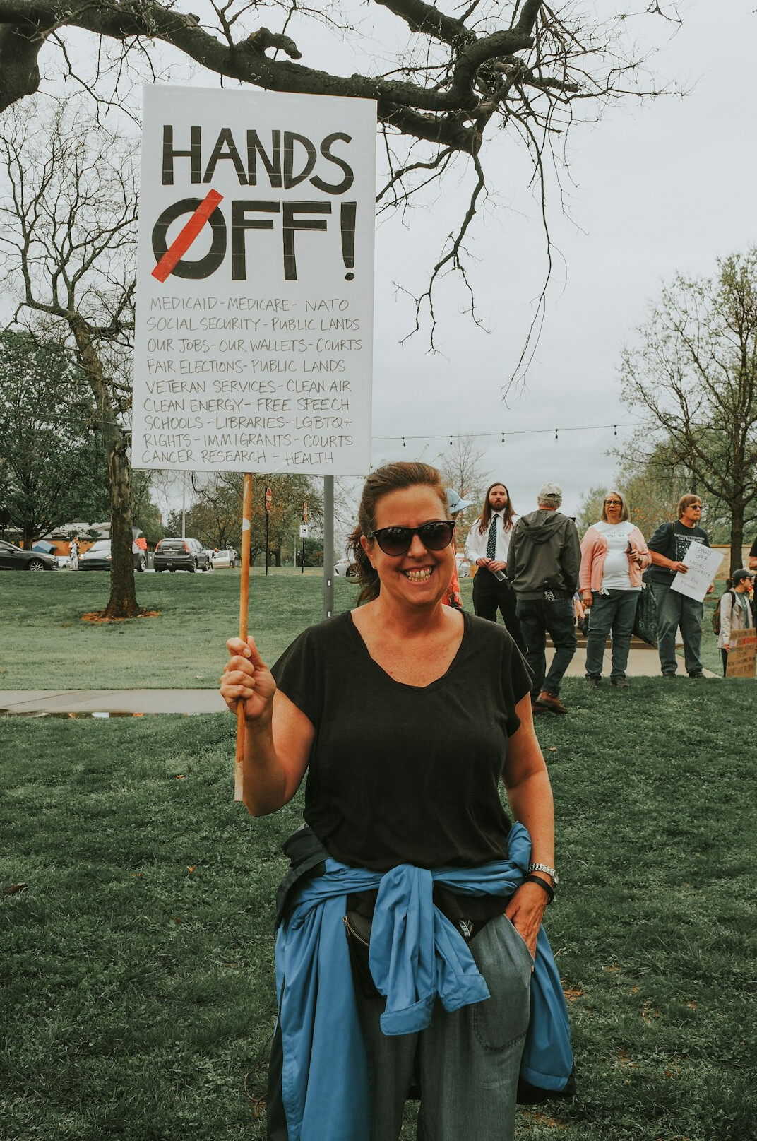 activist holding transparency sign